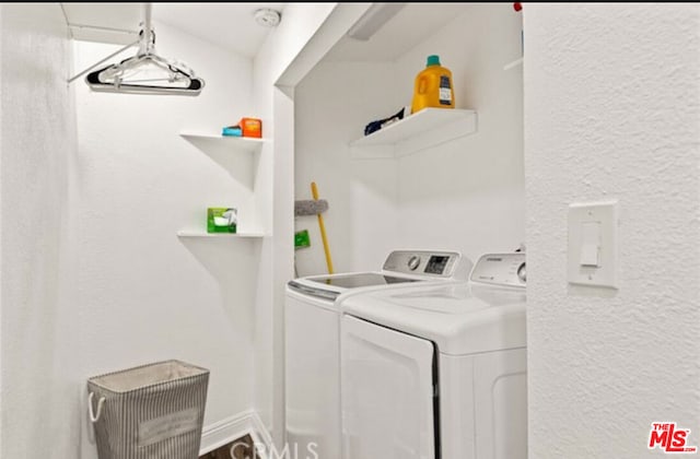 laundry room featuring washer and clothes dryer