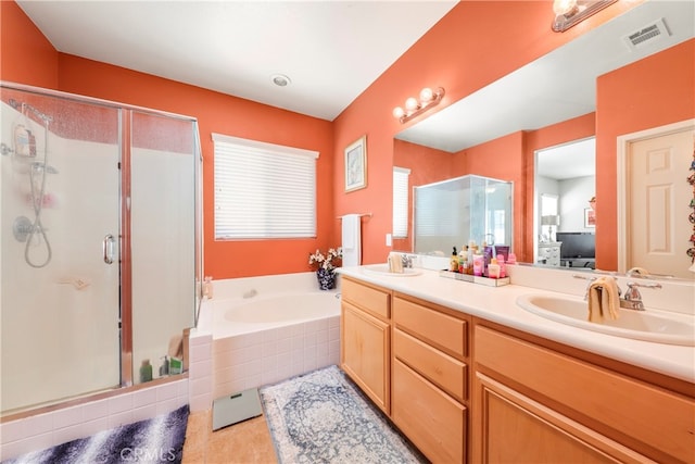 bathroom featuring vanity and separate shower and tub