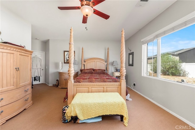 bedroom with ceiling fan and light colored carpet