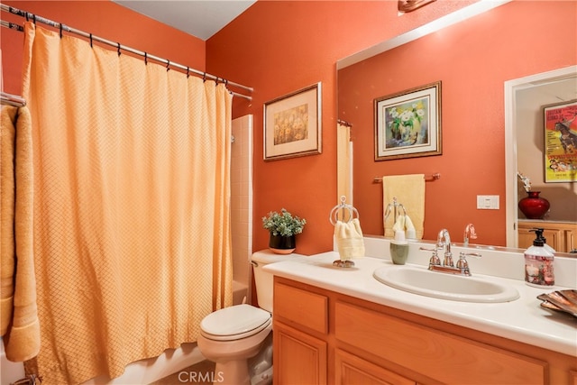 full bathroom with shower / bath combo, vanity, and toilet