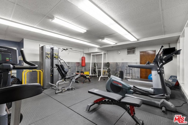 workout area featuring a drop ceiling