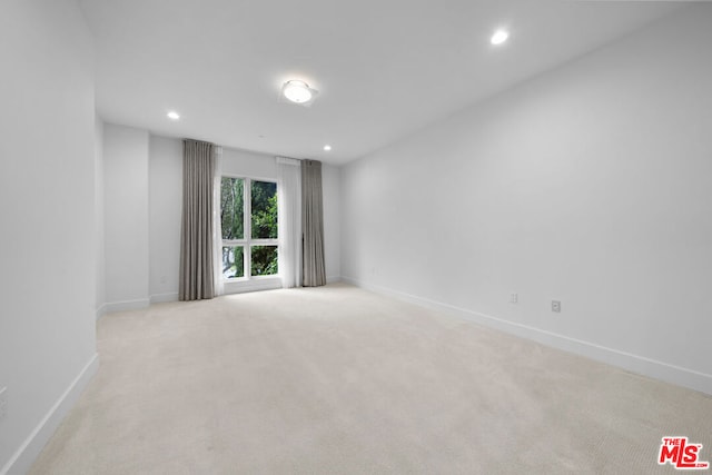 empty room with light colored carpet