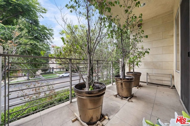 view of patio featuring a balcony