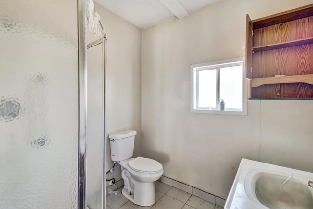 bathroom with sink, tile patterned flooring, and toilet