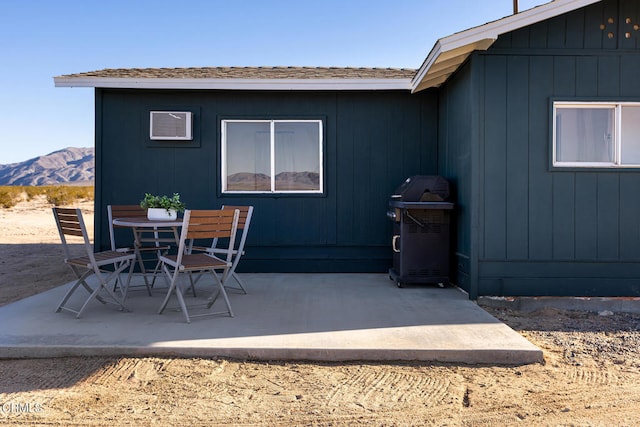 view of patio / terrace featuring a mountain view and grilling area