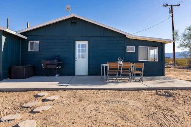 back of house with a patio