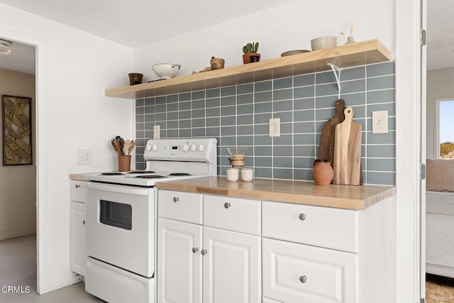 kitchen with white cabinets, white electric range oven, and decorative backsplash