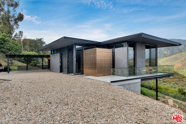 exterior space with a mountain view