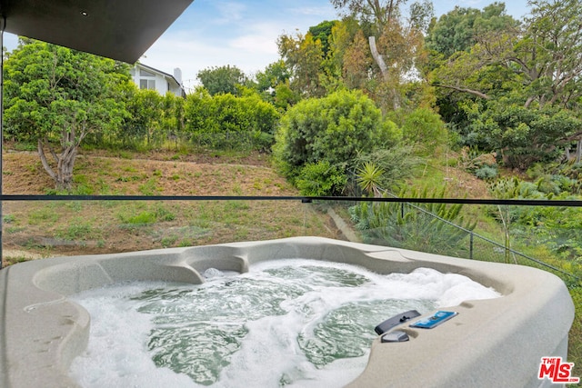 balcony with a hot tub