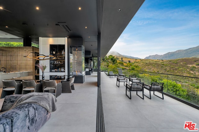 view of patio / terrace featuring outdoor lounge area and a mountain view