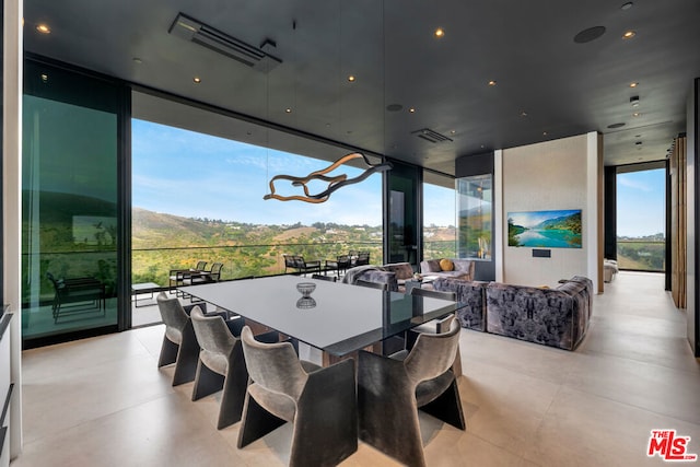 dining area with floor to ceiling windows and a healthy amount of sunlight