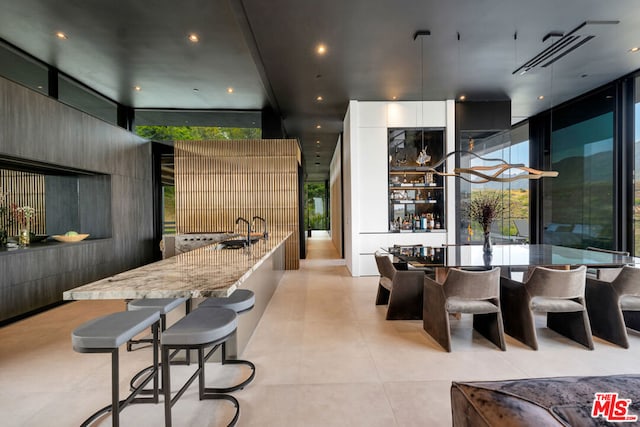 dining space featuring expansive windows