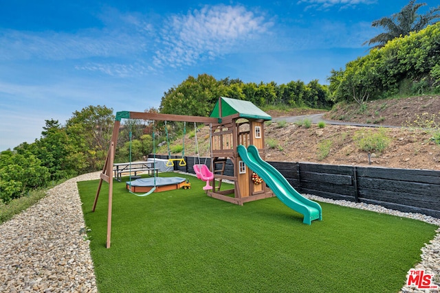 view of playground featuring a lawn