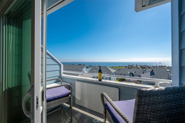 balcony featuring a water view