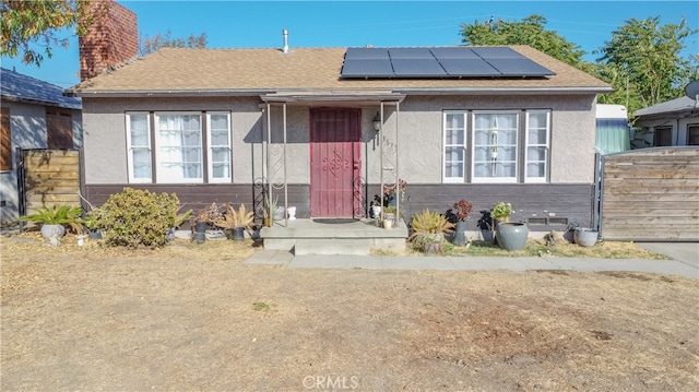 view of front of home with solar panels