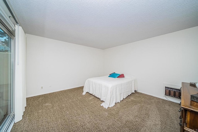 carpeted bedroom with a textured ceiling