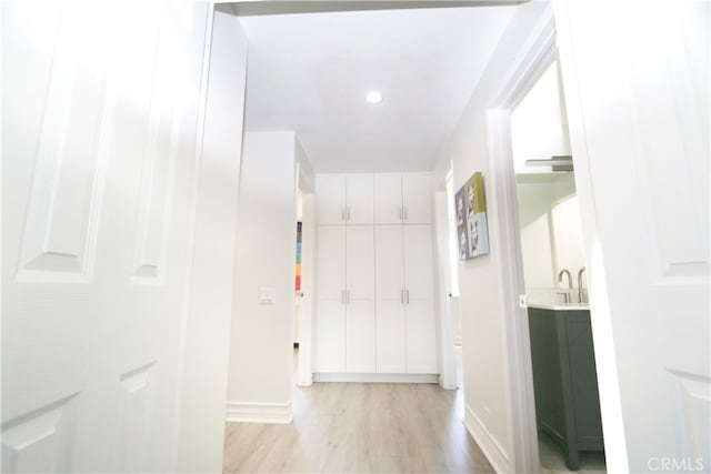 hallway with light wood-type flooring