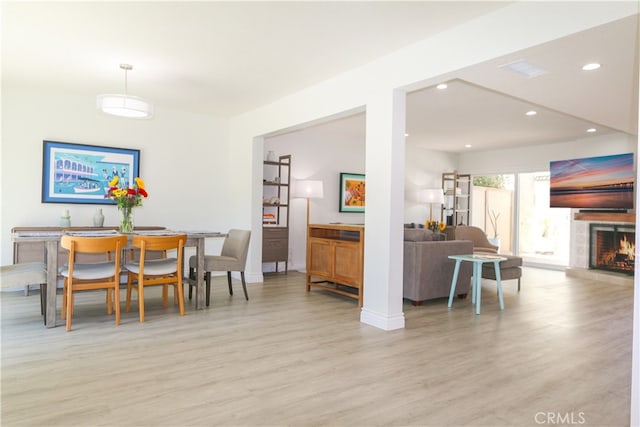 dining area with light hardwood / wood-style flooring