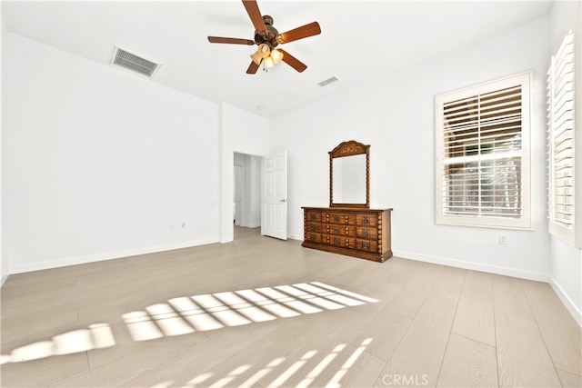 unfurnished bedroom with hardwood / wood-style floors and ceiling fan