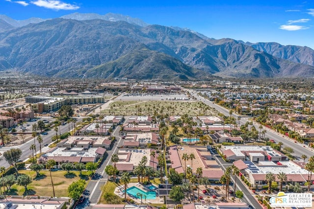 birds eye view of property featuring a mountain view