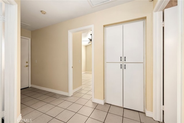 hallway featuring light tile patterned floors