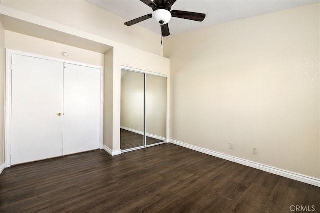 unfurnished bedroom featuring dark wood-type flooring and ceiling fan