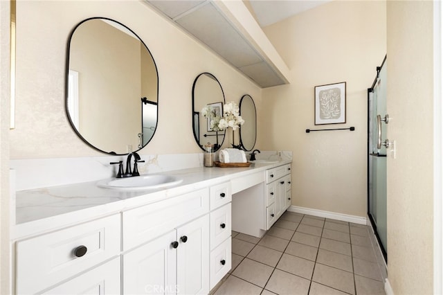 bathroom featuring vanity, tile patterned floors, and an enclosed shower