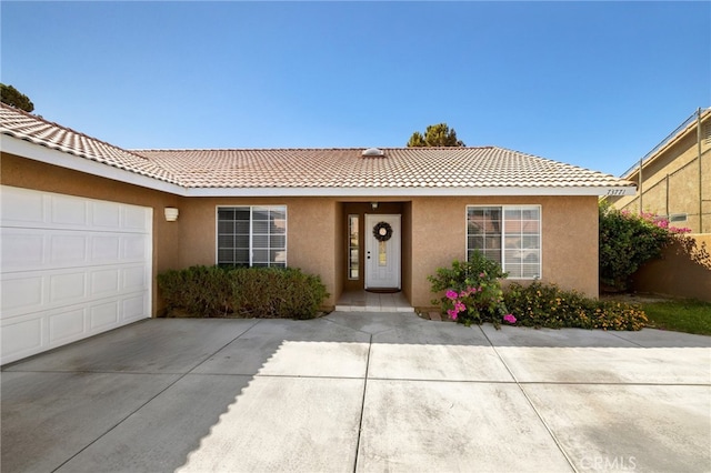 single story home with a garage