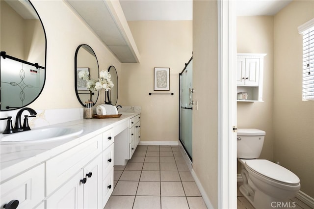 bathroom with vanity, a shower with shower door, toilet, and tile patterned flooring