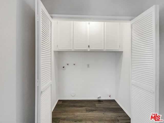 laundry area with washer hookup, cabinets, dark hardwood / wood-style floors, and gas dryer hookup