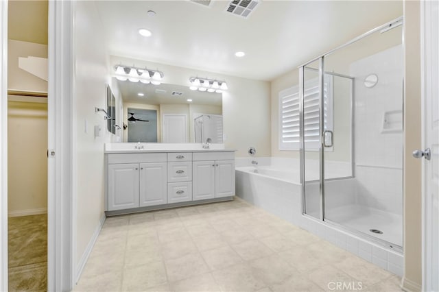 bathroom featuring vanity and plus walk in shower