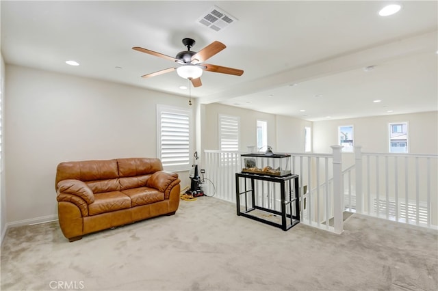 sitting room featuring ceiling fan and light colored carpet