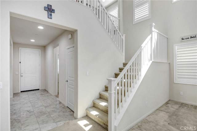 staircase with plenty of natural light