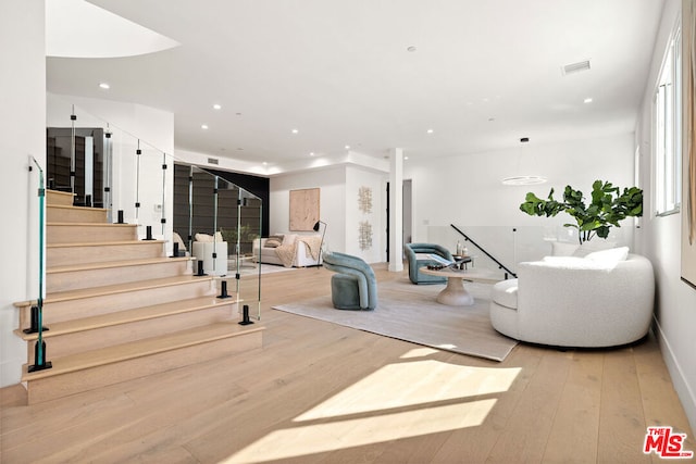 interior space with light hardwood / wood-style floors and a wealth of natural light