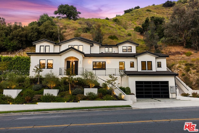 view of front of house with a mountain view and a garage