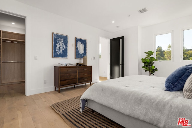 bedroom featuring light hardwood / wood-style flooring