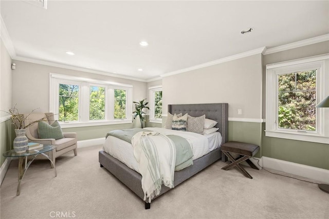 carpeted bedroom featuring multiple windows and crown molding