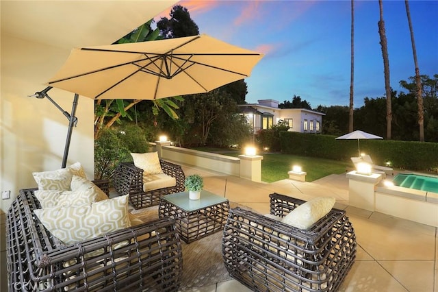 patio terrace at dusk with outdoor lounge area