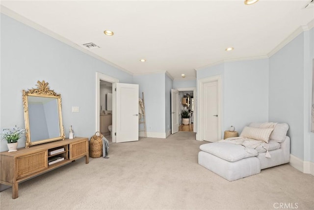 sitting room with ornamental molding and light carpet