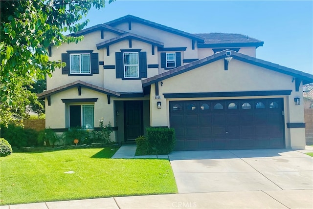 view of front of property with a garage and a front lawn