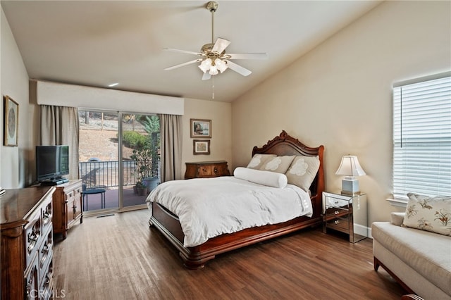 bedroom featuring multiple windows, access to outside, dark hardwood / wood-style floors, and ceiling fan