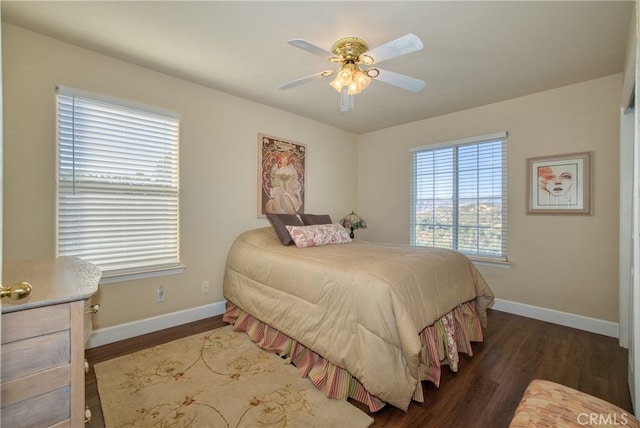 bedroom featuring ceiling fan and dark wood-type flooring