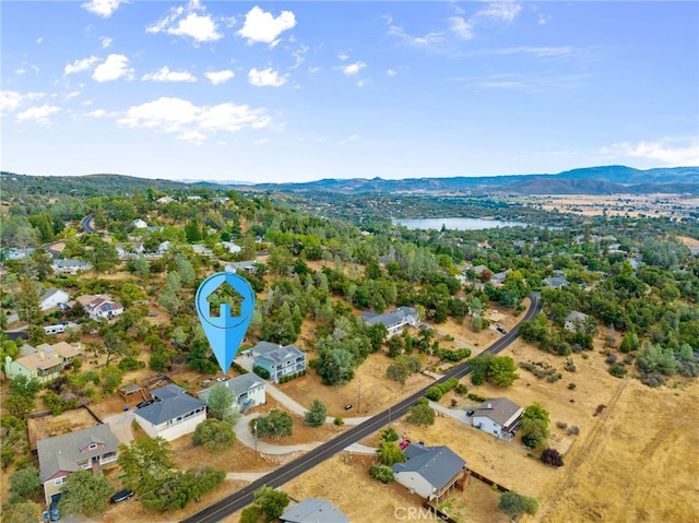 birds eye view of property featuring a mountain view