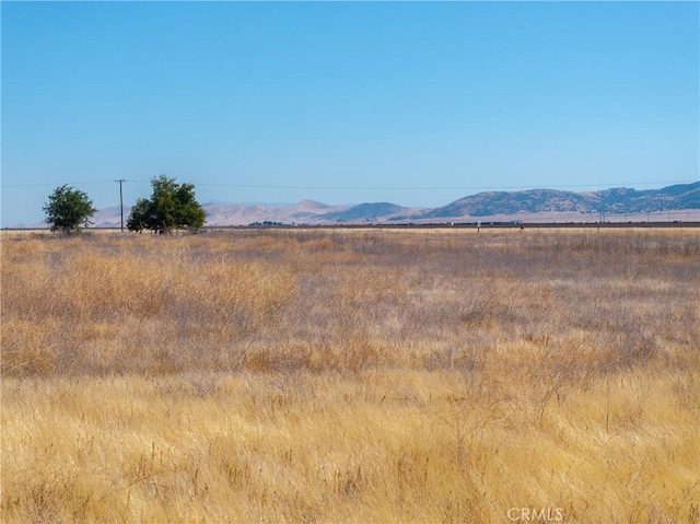 view of mountain feature with a rural view