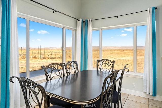 tiled dining area with a rural view