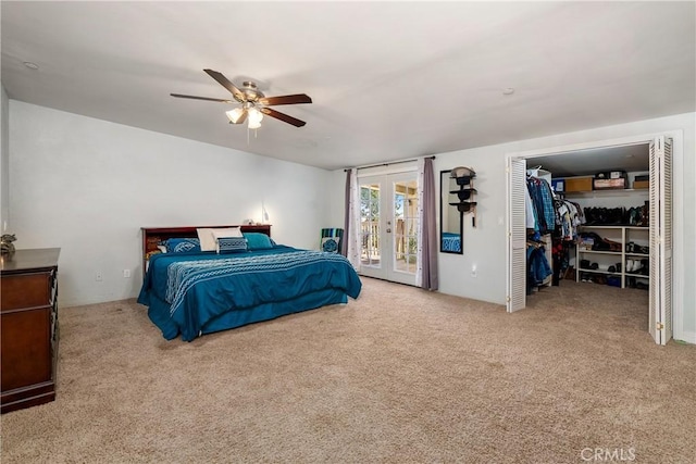 bedroom with french doors, access to exterior, ceiling fan, light carpet, and a closet