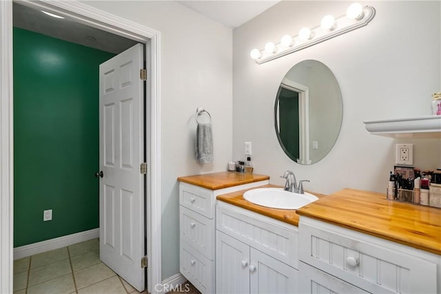 bathroom with vanity and tile patterned flooring