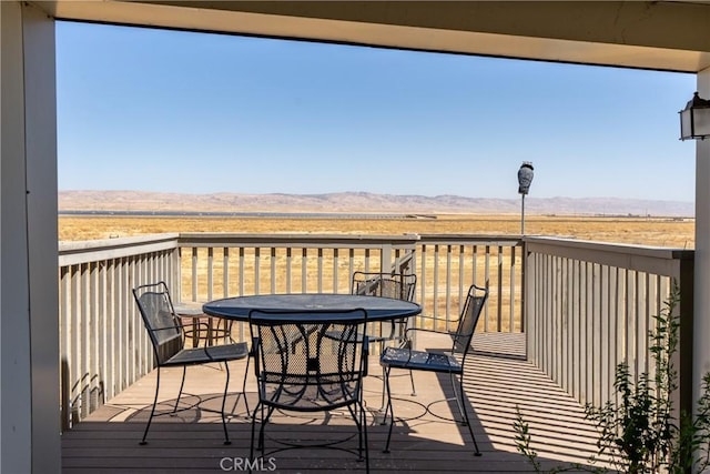 wooden terrace featuring a mountain view