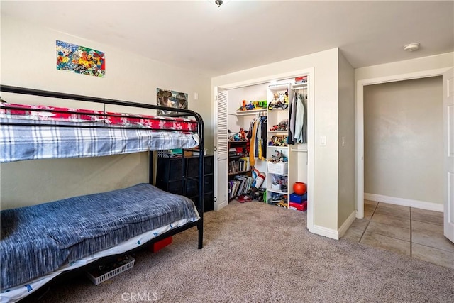 bedroom featuring carpet and a closet