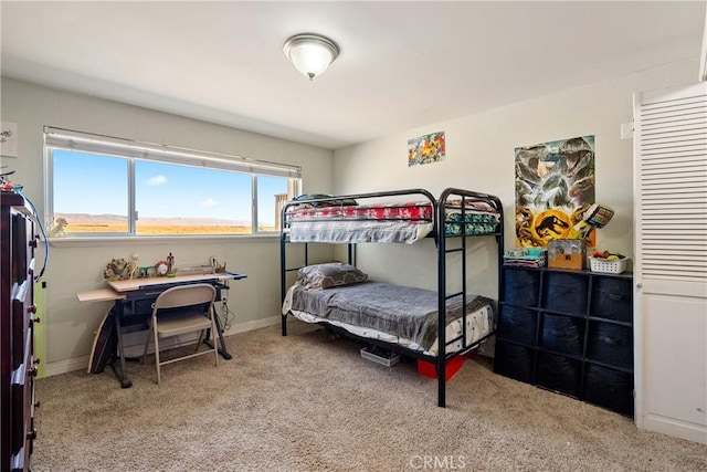 carpeted bedroom featuring a mountain view